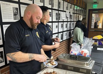 Astoria police serve rice bowls at Clatsop Clash fundraiser