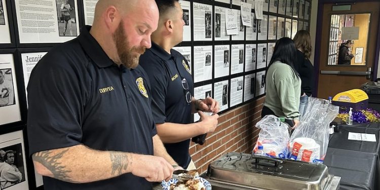 Astoria police serve rice bowls at Clatsop Clash fundraiser