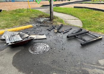 Astoria Parks crews clean up damaged trash can after holiday celebrations at Fred Lindstrom Park